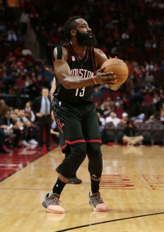 James Harden of the Houston Rockets shoots a three-pointer during a NBA game in Houston, Texas