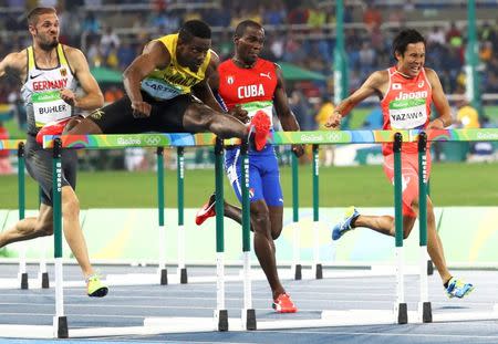 2016 Rio Olympics - Athletics - Preliminary - Men's 110m Hurdles Round 1 - Olympic Stadium - Rio de Janeiro, Brazil - 15/08/2016. Matthias Buhler (GER) of Germany, Deuce Carter (JAM) of Jamaica, Yohany Portilla (CUB) of Cuba and Wataru Yazawa (JPN) of Japan compete in a heat re-run. REUTERS/Leonhard Foeger