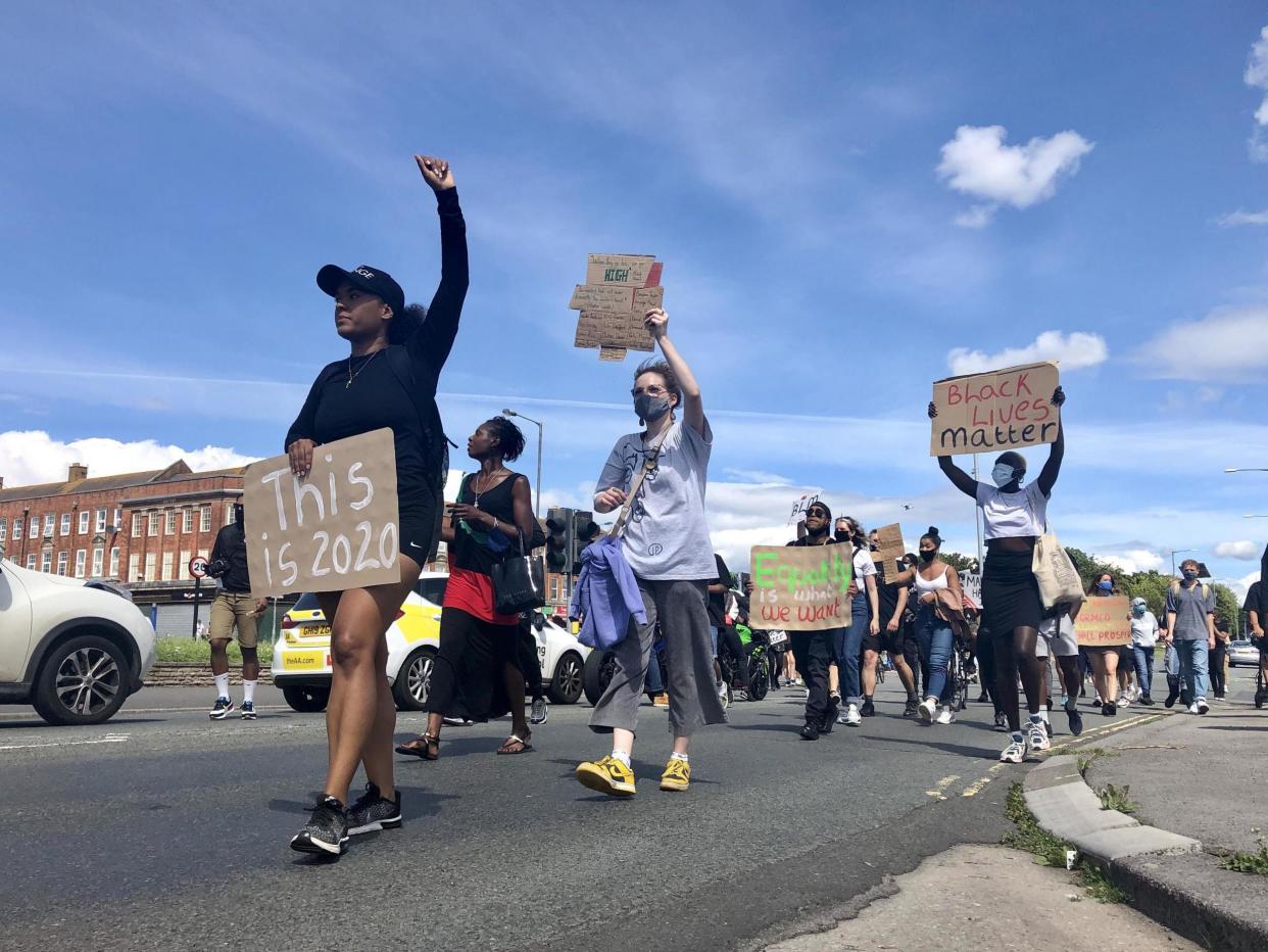 Protesters march down a street in Bristol on 2 August, 2020, after a racially-aggravated attack on a 21-year-old NHS worker in the city: Claire Hayhurst/PA Wire