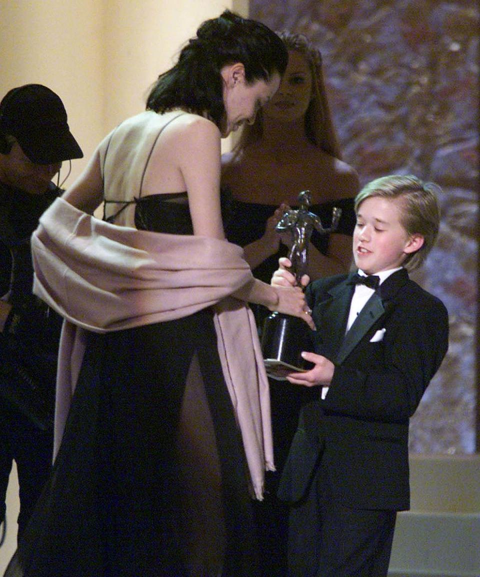 <p>Accepting the 2000 SAG Award for Best Supporting Role in a Motion Picture for <em>Girl, Interrupted</em>—from an 11-year-old Haley Joel Osment.</p>