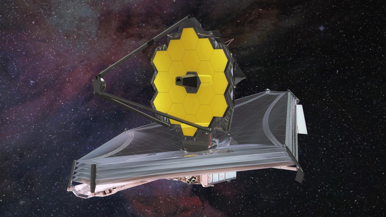  An artist's impression of the James Webb Space Telescope. It's golden mirror is seen atop its silvery sunshield floating in space. 