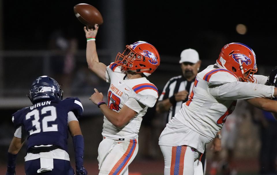 Jeremiah Knox (QB 12) tries to throw a pass to his receiver at a high school football game against Del Valle on Friday, Sept. 16, 2022, at Del Valle High School in El Paso, Texas.