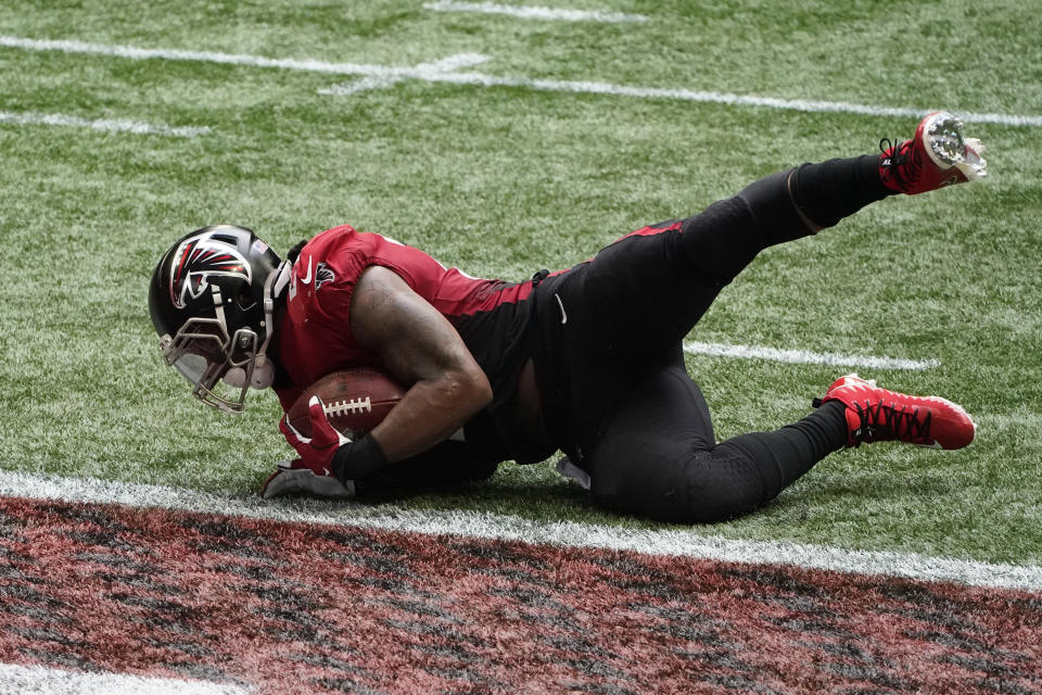 Atlanta Falcons running back Todd Gurley (21) scores a touchdown against the Detroit Lions, one which he'd like to have back. (AP Photo/John Bazemore)