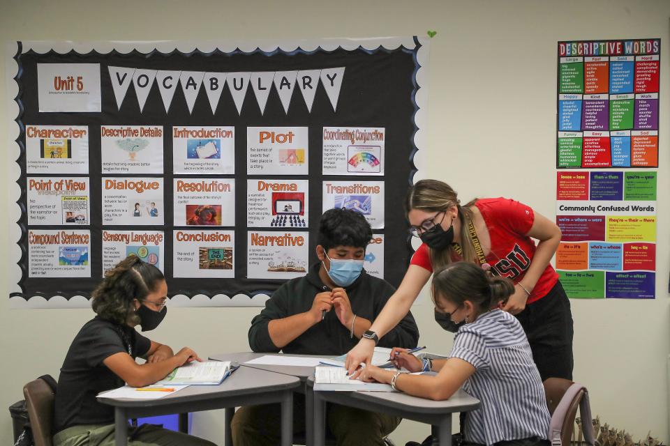 Grisel Avila, right, teaches her students in a dual immersion English and Spanish language class at Raymond Cree Middle School in Palm Springs, Calif., May 3, 2022.