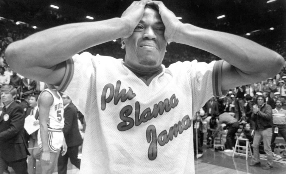 FILE - Houston's Renaldo Thomas holds his head after losing 54-52 to North Carolina State in the championship game of the NCAA college basketball championship game in Albuquerque, N.M., April 4, 1983. (Larry Reese/Houston Chronicle via AP, File)