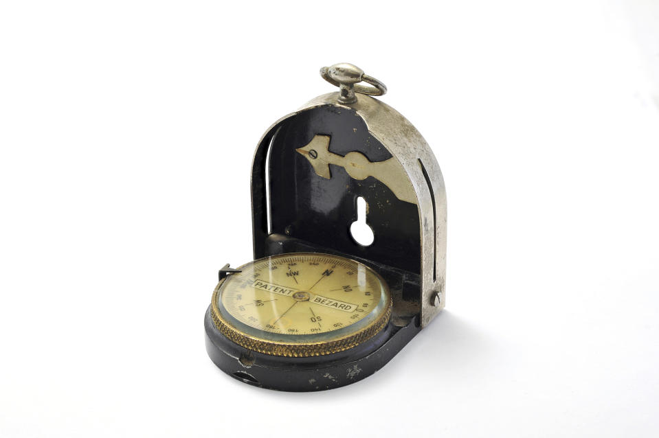 This Feb. 25, 2019 photo shows a compass being sold by Boston-based RR Auction. Several personal possessions of Oskar Schindler, the German industrialist credited with saving the lives of more than 1,000 Jews during World War II, are up for auction. Schindler's Longines wristwatch, a compass he and his wife reportedly used in 1945 as they fled advancing Russian troops, two Parker fountain pens in a case, and several other items are being sold by RR Auction of Boston. The belongings are being sold as a package and are expected to fetch about $25,000 in the auction that ends March 6. (Howard Fohlin/RR Auction via AP)