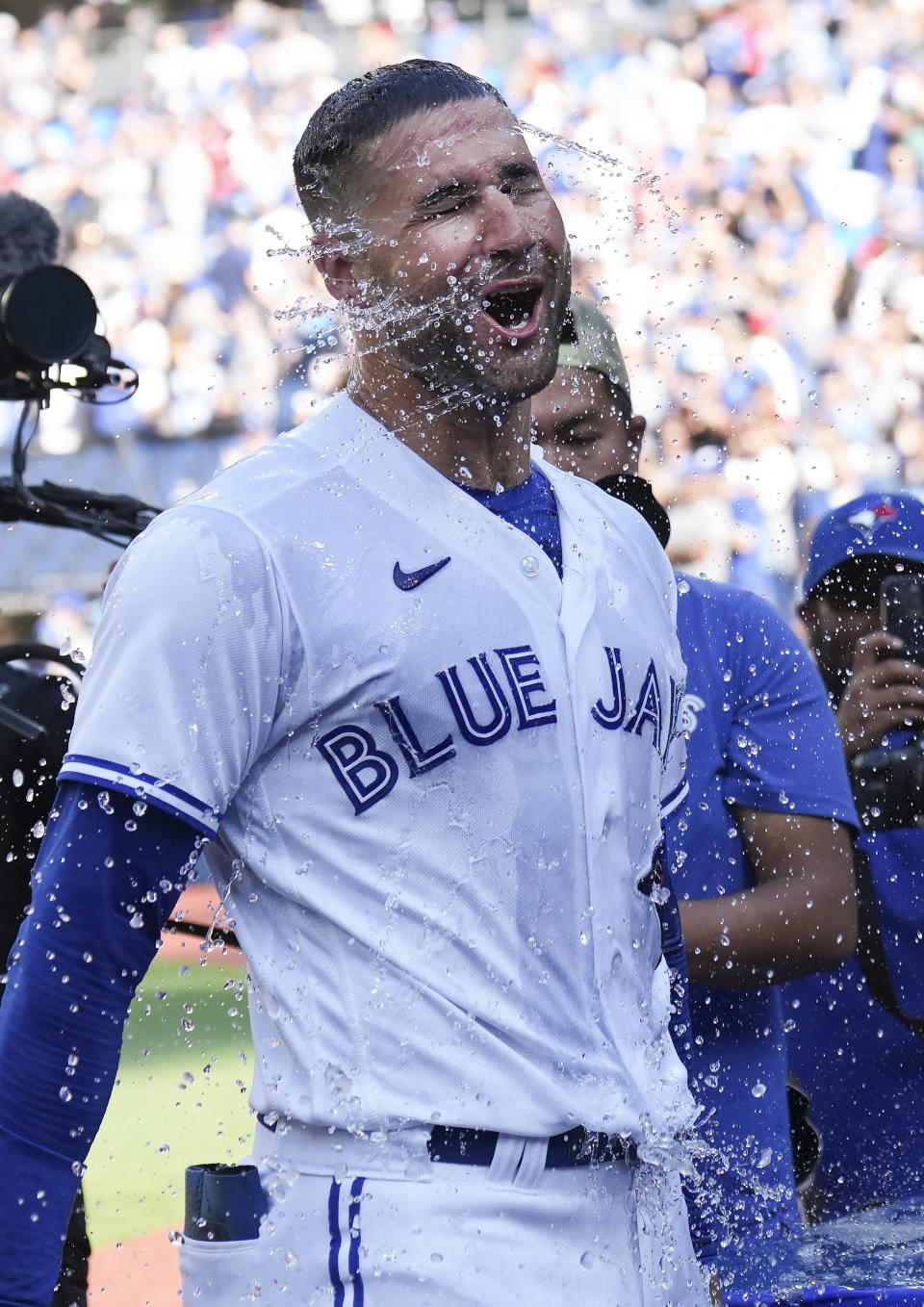 Toronto Blue Jays center fielder Kevin Kiermaier gets water dumped on him after defeating the Kansas City Royals during a baseball game in Toronto on Sunday, Sept. 10, 2023. (Nathan Denette/The Canadian Press via AP)