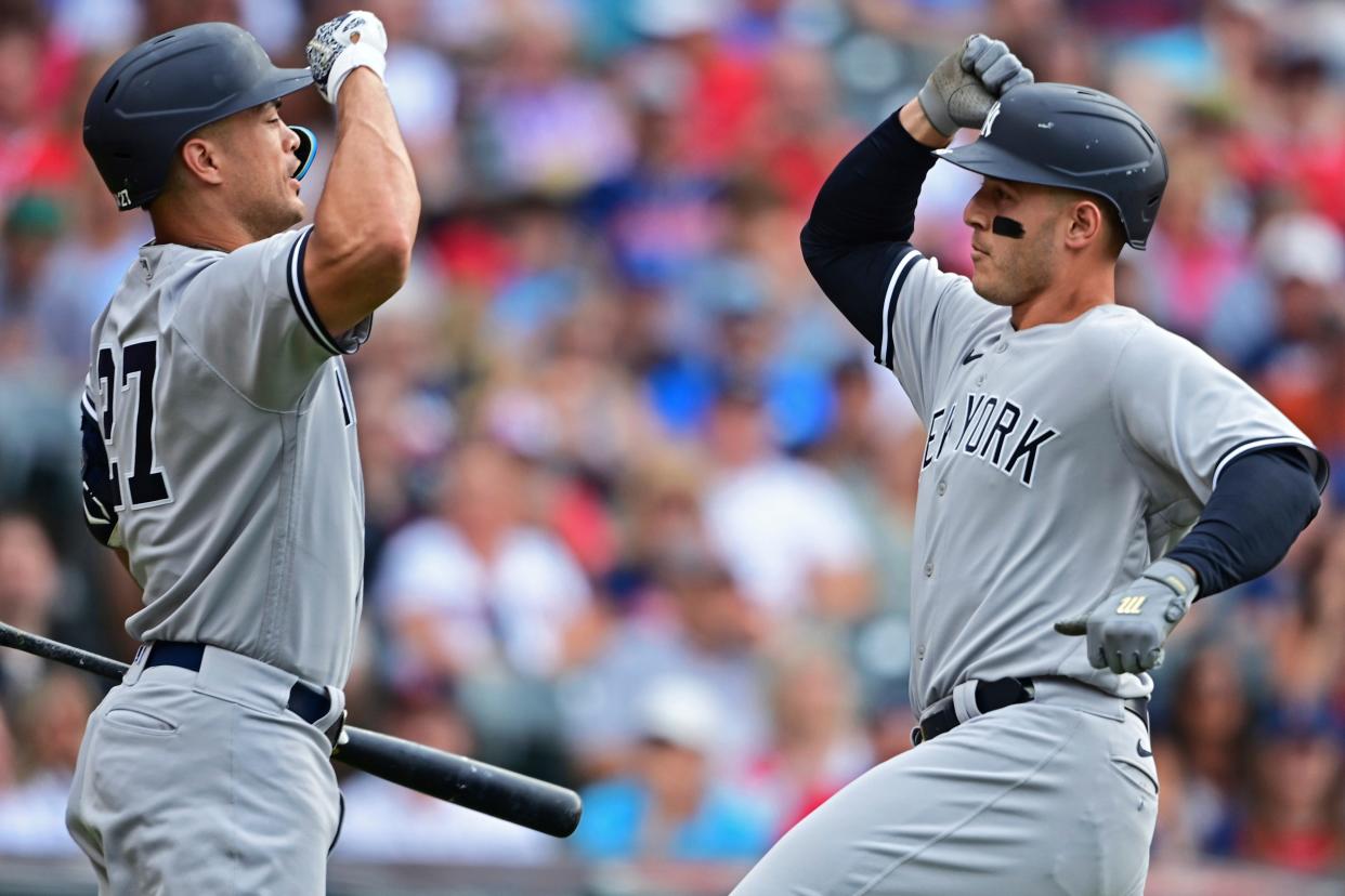 New York Yankees' Anthony Rizzo, right, is congratulated by Giancarlo Stanton after hitting a solo home run off Guardians starting pitcher Aaron Civale during the fourth inning in the second  game of a doubleheader Saturday, July 2, 2022, in Cleveland.