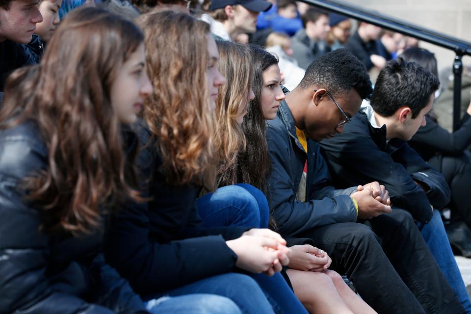 <p>Harvard University students observe a moment of silence during a protest against school shootings and gun violence on the steps of Widener Library on campus in Cambridge, Mass., Friday, April 20, 2018. (Photo: Michael Dwyer/AP) </p>