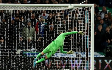 Orjan Nyland of Aston Villa pushes a shot onto the bar during the Carabao Cup Semi Final  - Credit: James Williamson - AMA/Getty Images