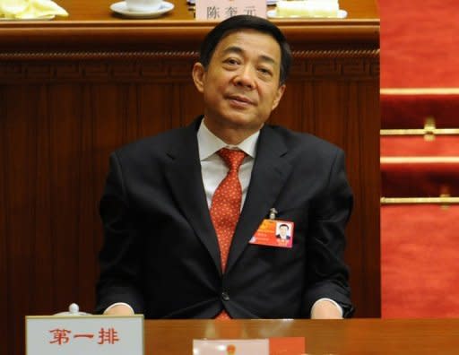 Fallen Chinese politician Bo Xilai, pictured here in March, is likely to face criminal trial for trying to protect his wife from murder charges, analysts said Thursday, after his former police chief was tried for defection