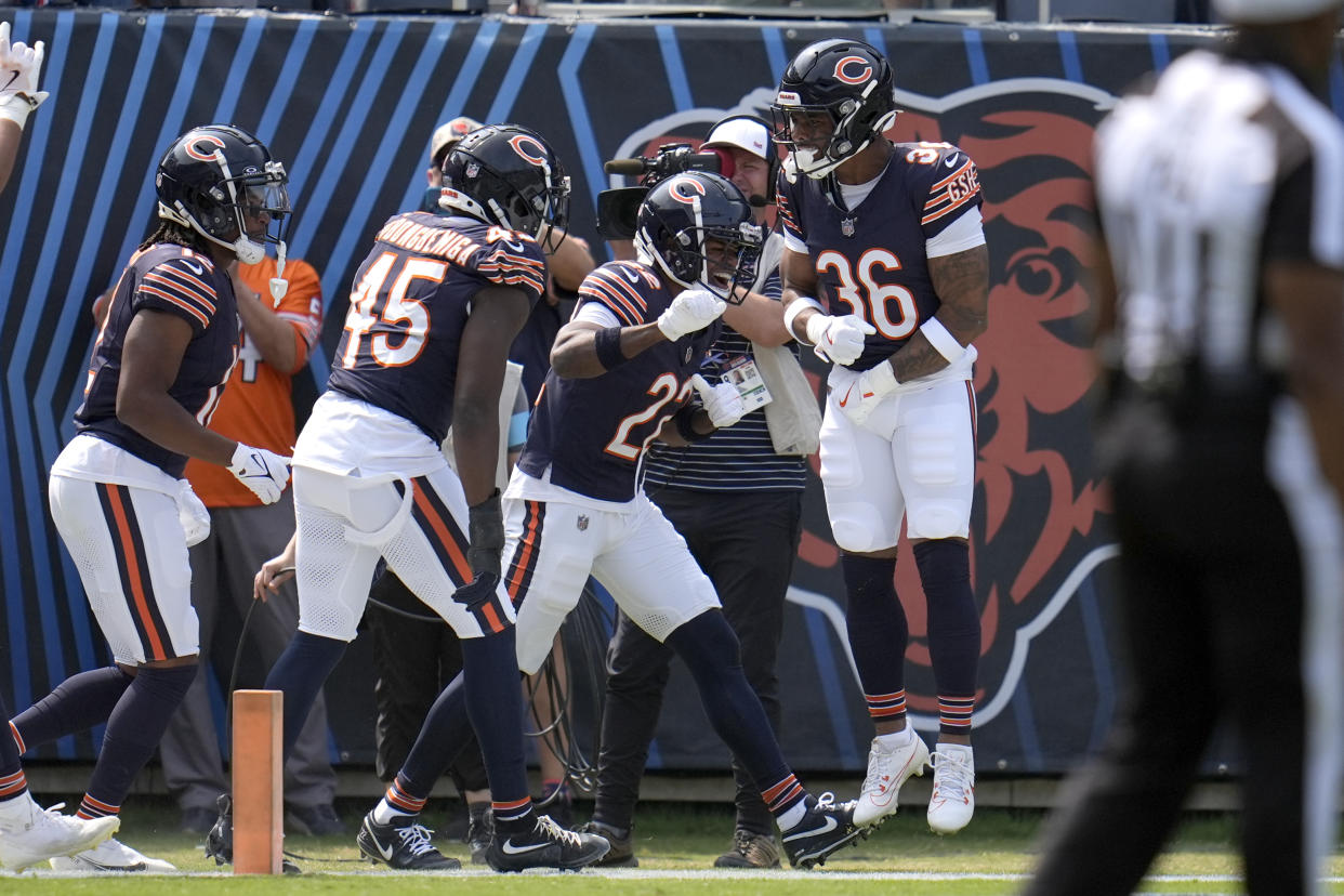 Jonathan Owens (36) celebrates with teammates after scoring Chicago's first touchdown of the season. (AP Photo/Erin Hooley)