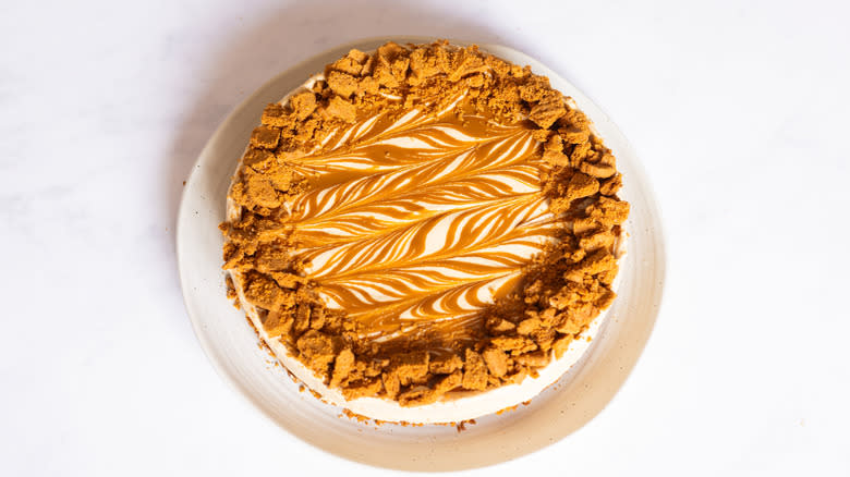 cheesecake topped with crumbled Biscoff biscuits 