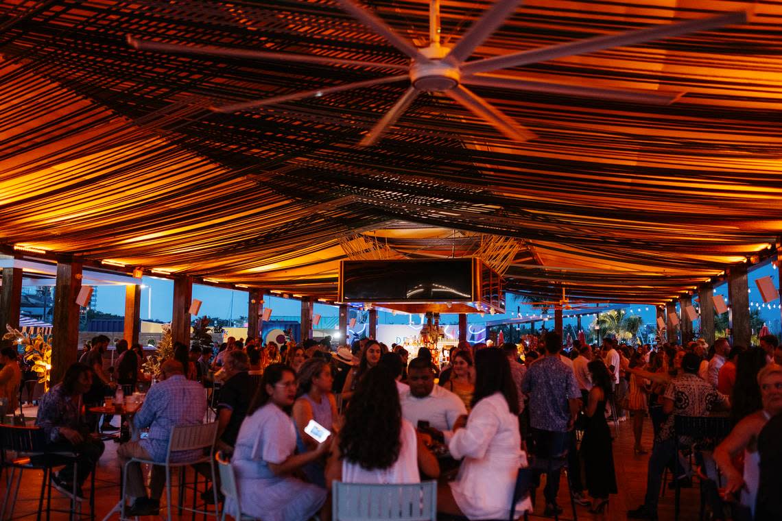 Giant fans keep guests cool at Regatta Grove in Coconut Grove.