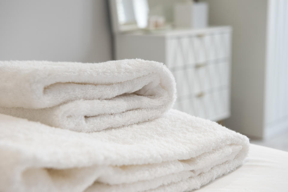 White towels folded on a bed