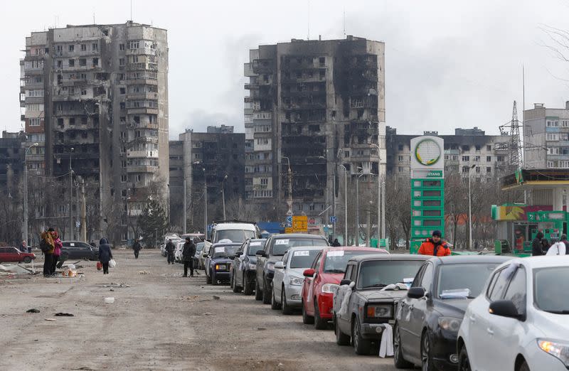 FILE PHOTO: Evacuees leave the besieged city of Mariupol