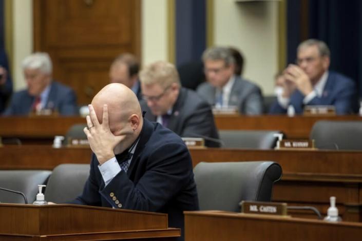 Rep. Anthony Gonzalez (R-Ohio) puts his hand to his face during a hearing of the House Committee on Financial Services in Capitol Hill, Washington, Wednesday, Dec. 1, 2021.  (AP Photo/Amanda Andrade-Rhoades)