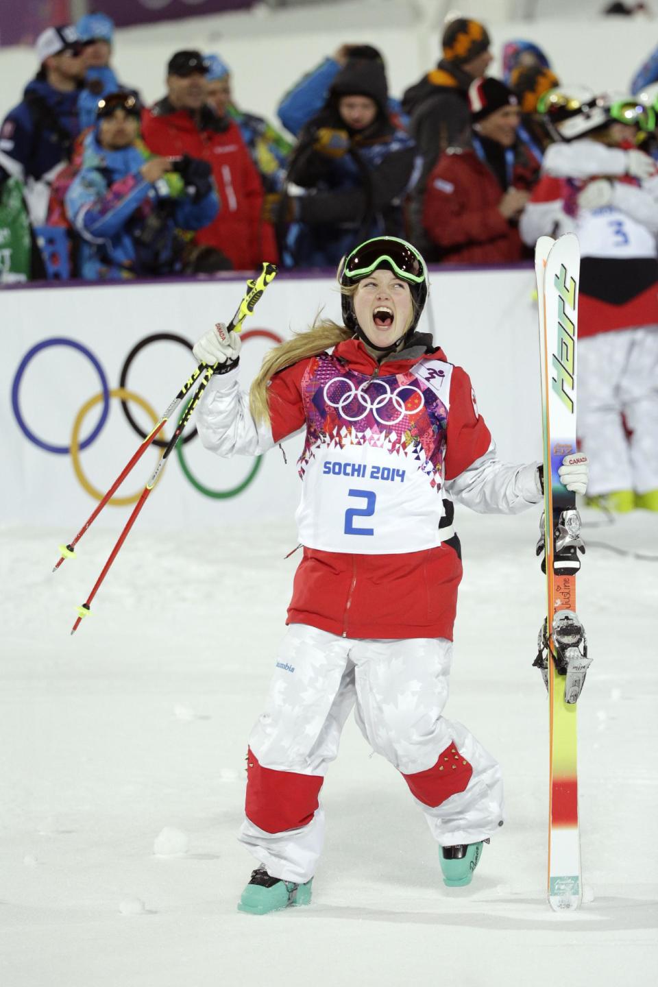Canada's Justine Dufour-Lapointe celebrates after winning the gold medal final in the women's moguls at the 2014 Winter Olympics, Saturday, Feb. 8, 2014, in Krasnaya Polyana, Russia. (AP Photo/Jae C. Hong)