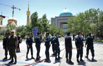 <p>Police officers control the scene, around of shrine of late Iranian revolutionary founder Ayatollah Khomeini, after an assault of several attackers in Tehran, just outside Tehran, Iran, Wednesday, June 7, 2017. (Photo: Ebrahim Noroozi/AP) </p>