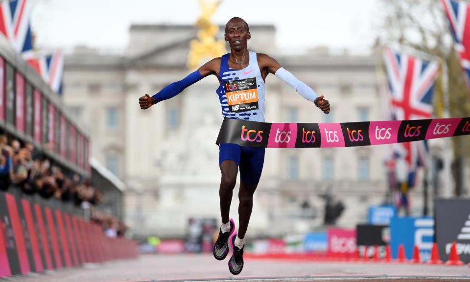 <span>Kelvin Kiptum crosses the finish line in a course-record time to win the London Marathon last year.</span><span>Photograph: Alex Davidson/Getty Images</span>