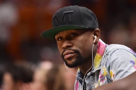 FILE PHOTO: Apr 11, 2018; Miami, FL, USA; Boxer Floyd Mayweather Jr. in attendance during the first half between the Miami Heat and the Toronto Raptors at American Airlines Arena. Mandatory Credit: Jasen Vinlove-USA TODAY Sports/File Photo