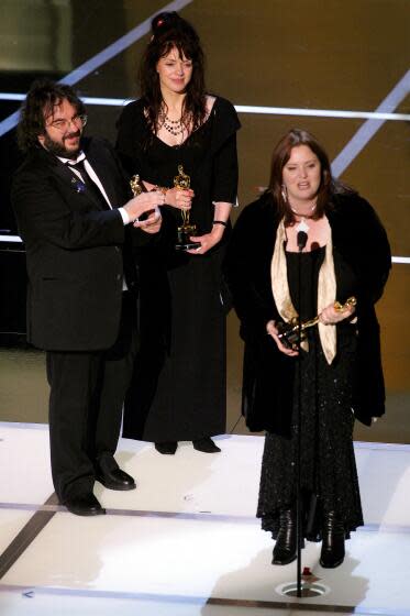 Best Adapted Screenplay-left to right-Peter Jackson, Fran Walsh and Philippa Boyens.