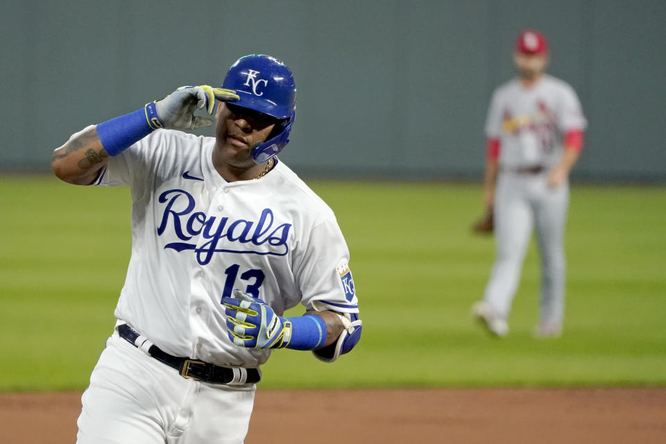 Kansas City Royals' Salvador Perez celebrates as he runs the bases after hitting a two-run home run during the first inning of the team's baseball game against the St. Louis Cardinals on Wednesday, Sept. 23, 2020, in Kansas City, Mo. (AP Photo/Charlie Riedel)