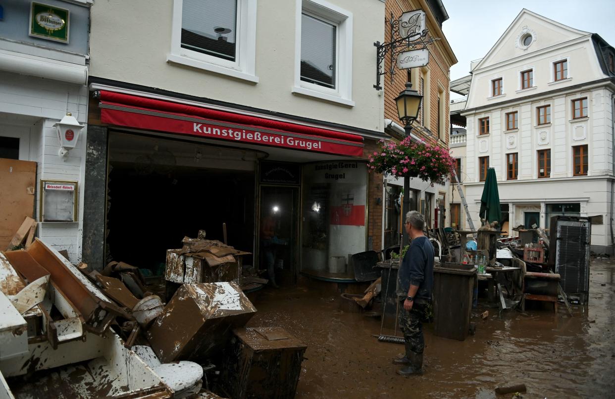 A resident reacts in front of damaged furnitures following heavy rains and floods in Ahrweiler-Bad Neenah, western Germany, on July 15, 2021. - German authorities said late July 15, 2021 that at least 58 people had likely died in massive storms and flooding in the country's west, an increase on the earlier toll of 45 dead. (Photo by Christof STACHE / AFP) (Photo by CHRISTOF STACHE/AFP via Getty Images)