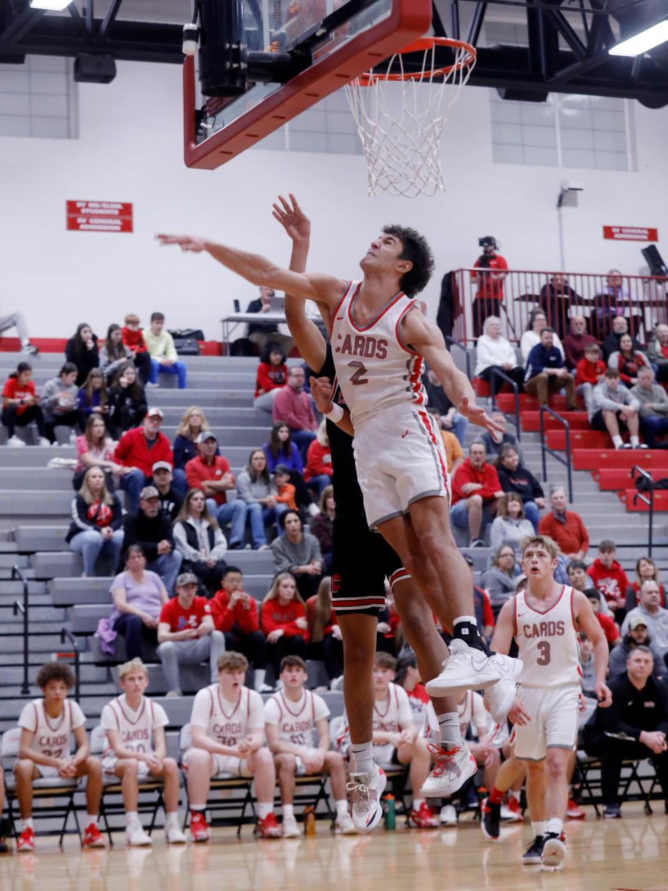 Nick Petro goes up for a block on Alex Taylor, of Coshocton, during Sandy Valley's 47-38 loss in a Division III sectional game on Tuesday night in Sandyville. Coshocton improved to 16-7.
