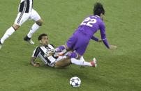 <p>Juventus’ Dani Alves fights for the ball against Real Madrid’s Isco during the Champions League Final soccer match between Juventus and Real Madrid at the Millennium Stadium in Cardiff </p>