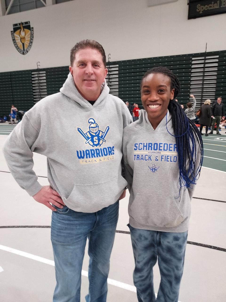 Webster Schroeder girls indoor track assistant coach Dan Graf with Camryn Cole, after she set the Section V high jump record at 5 feet, 11 inches on Jan. 11 at SUNY Brockport.