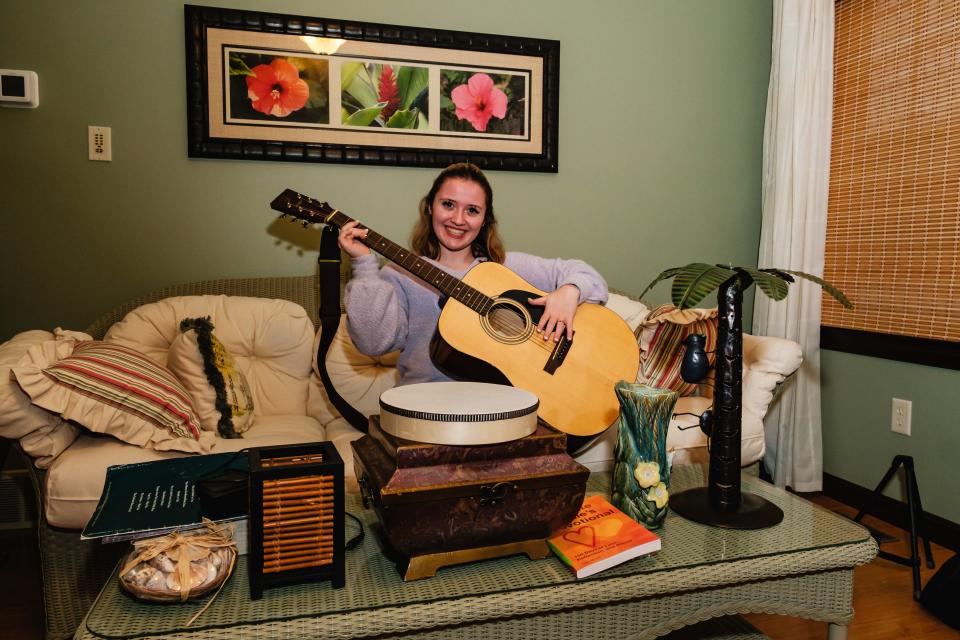 Kami Huff, pictured in her Dover Township home, is a Dover High School student and recording artist. In addition to playing piano and signing, she hopes to pick up guitar to add to her repertoire.