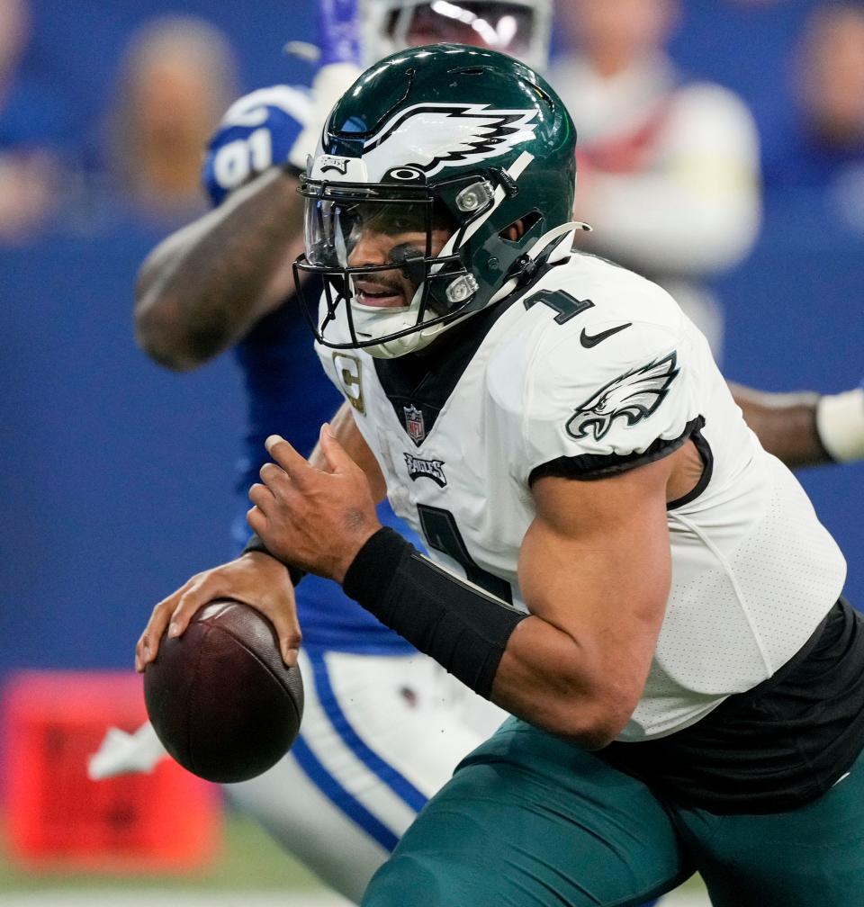 Philadelphia Eagles quarterback Jalen Hurts (1) scrambles with the ball Sunday, Nov. 20, 2022, during a game against the Indianapolis Colts at Lucas Oil Stadium in Indianapolis.