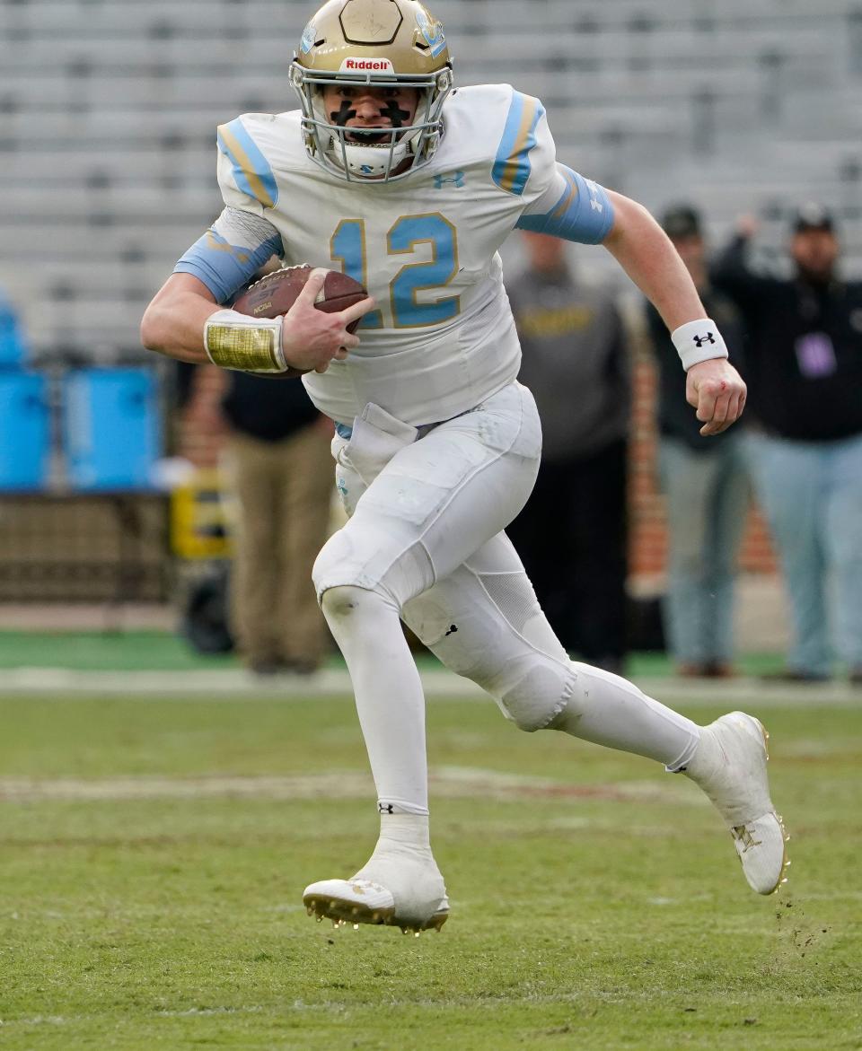 Coosa Christian's John David Justus (12) runs the ball during the 1A AHSAA State Championship Game in Bryant-Denny Stadium Thursday, Dec. 7, 2023, in Tuscaloosa.