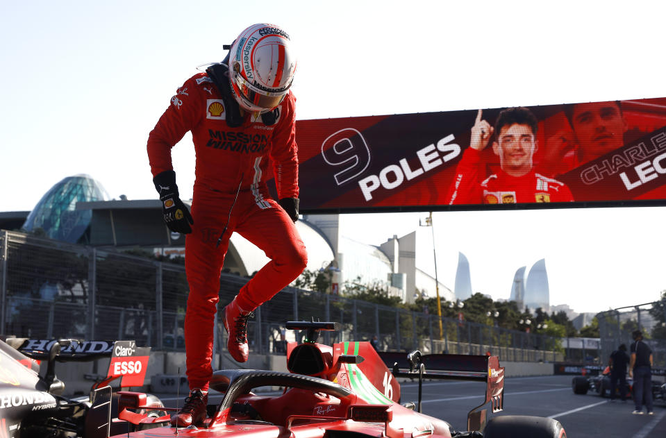 Ferrari driver Charles Leclerc of Monaco steps out of his car after taking pole position during the qualifying session at the Baku Formula One city circuit in Baku, Azerbaijan, Saturday, June 5, 2021. The Azerbaijan Formula One Grand Prix will take place on Sunday. (Maxim Shemetov, Pool via AP)