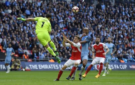 Britain Football Soccer - Arsenal v Manchester City - FA Cup Semi Final - Wembley Stadium - 23/4/17 Manchester City's Claudio Bravo and Vincent Kompany in action with Arsenal's Aaron Ramsey Reuters / Toby Melville Livepic