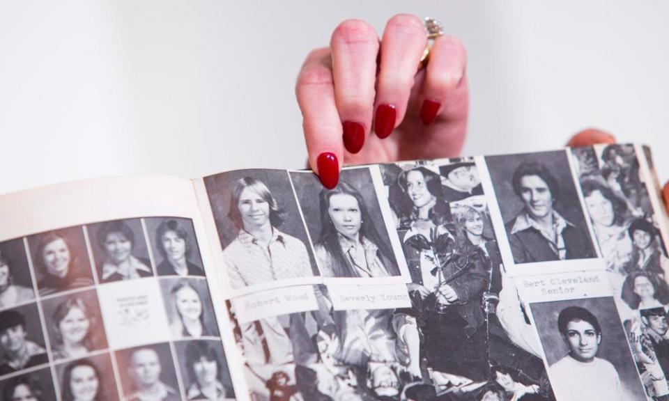 Beverly Young Nelson holds up a yearbook photo of herself. She has accused Roy Moore of assaulting her when she was 16.