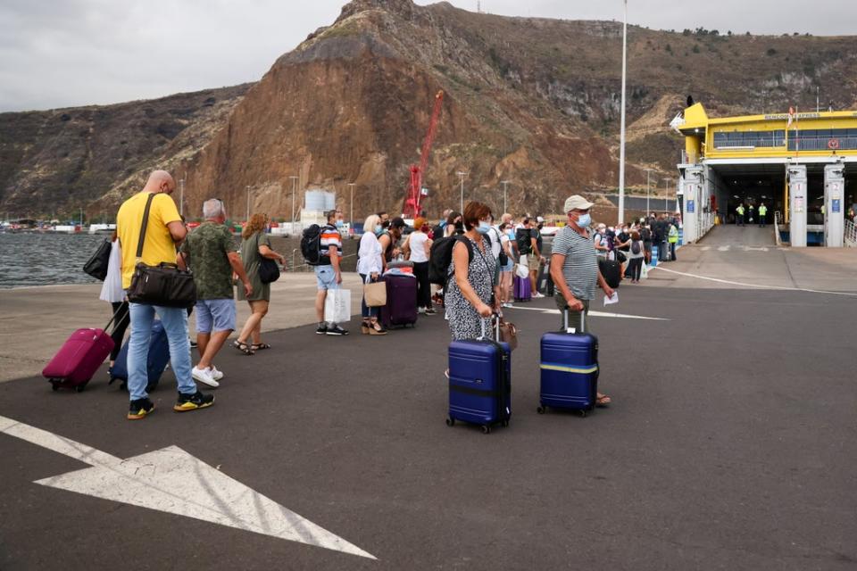 Tourists turned to the ferry port after La Palma Airport closed (REUTERS)