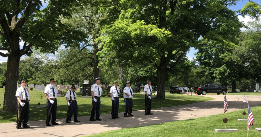 Veterans, community members and city officials paid tribute to fallen service members at Evergreen Cemetery in Lansing, May 25, 2024. (WLNS)