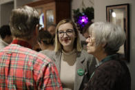 Abigail Bessler, center, daughter of Democratic presidential candidate Sen. Amy Klobuchar, D-Minn., talks to members of the Montgomery Co. Democrats during a campaign gathering Tuesday, Jan. 21, 2020, in Stanton, Iowa. (AP Photo/Marcio Jose Sanchez)