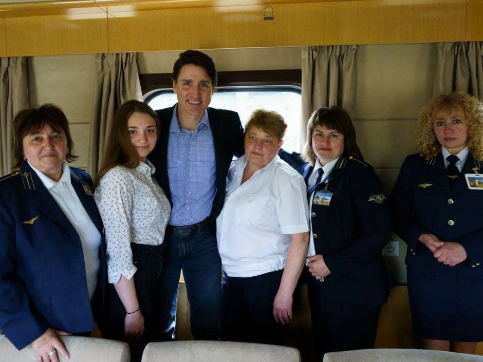 Canadian Prime Minister Justin Trudeau with rail staff on board the Ukrainian Railways.