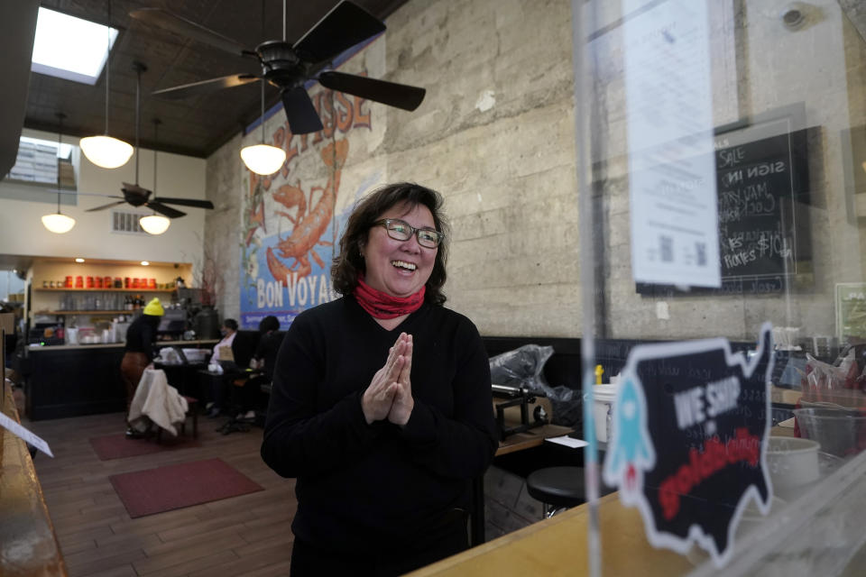 Chef Proprieter Brenda Buenviaje smiles as she is interviewed at Brenda's French Soul Food in San Francisco, Wednesday, Dec. 9, 2020. In pre-pandemic days, Brenda's French Soul Food was always hopping, but everything came to a screeching halt on March 16, when San Francisco halted indoor dining to stop the spread of the coronavirus. It reopened for takeout and delivery, and Buenviaje is now shipping meals nationwide through a service called Goldbelly. (AP Photo/Jeff Chiu)