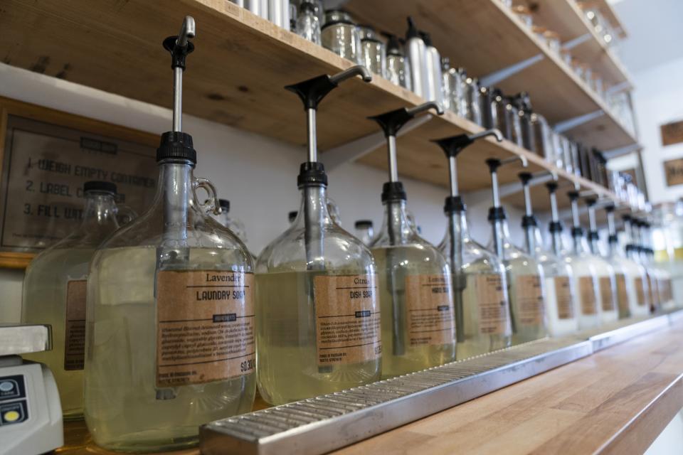 Concentrated laundry soap that customers can pump into their own refillable containers sits on a shelf at Good Buy Supply in Philadelphia, Tuesday, March 21, 2023. A growing number of companies are making bulky plastic jugs smaller and concentrating the detergent or soap. Rodia said folks of all ages are seeking concentrated detergents and other eco-friendly products. (AP Photo/Matt Rourke)