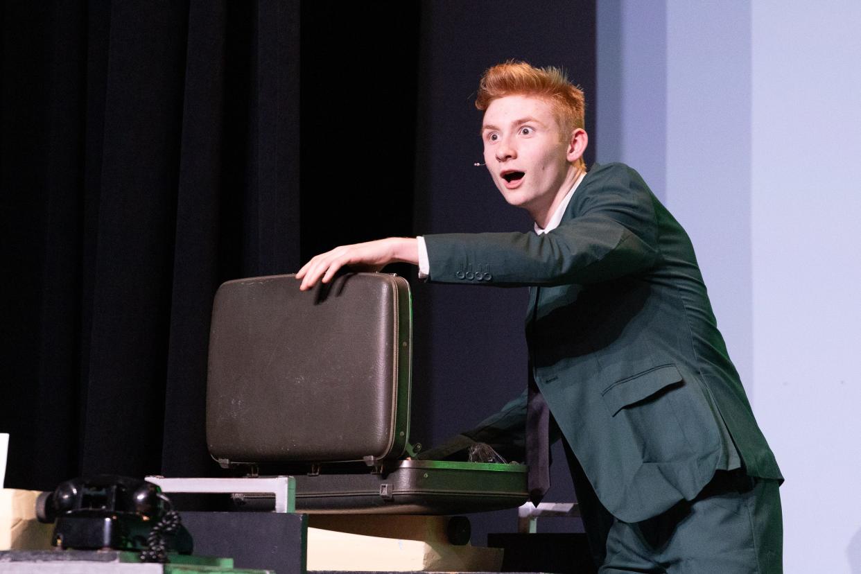 Sam Corry as J. Pierrepont Finch (that's F-I-N-C-H) in Carmel High School's production of "How to Succeed in Business Without Really Trying." Corry and fellow employees of World Wide Wickets are scheduled to perform at Pedro's Open Mic on May 11 at Harrison High School.