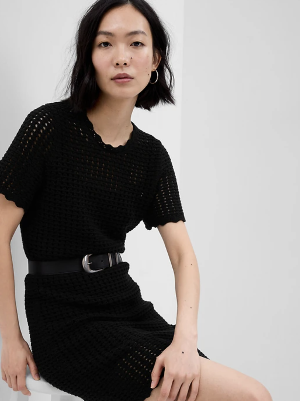 asian model wearing belted Crochet Mini Dress in black (photo via Gap)