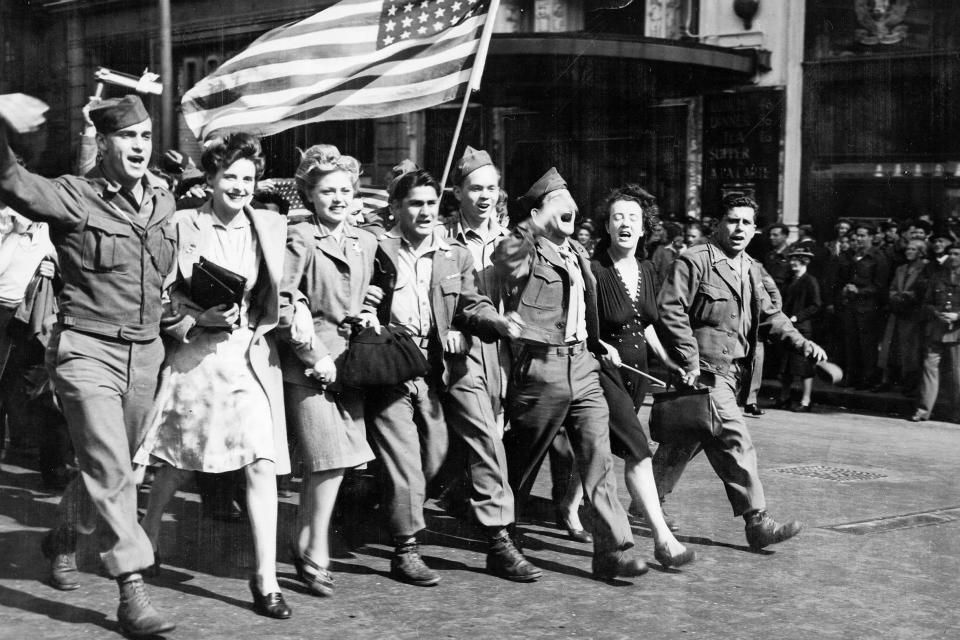 American soldiers parade the 'Stars and Stripes' through Piccadilly Circus, London (PA)