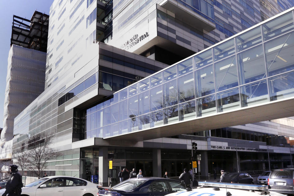 Pedestrians walk past the Shapiro Building at Brigham and Women's Hospital, Jan. 20, 2015, in Boston. More than 200 women have accused Dr. Derrick Todd, a former rheumatologist at Brigham and Women's Hospital in Boston, of sexual abusing them by performing unnecessary pelvic and breast exams while under his care, which took place over 14 years. (AP Photo/Steven Senne, File)