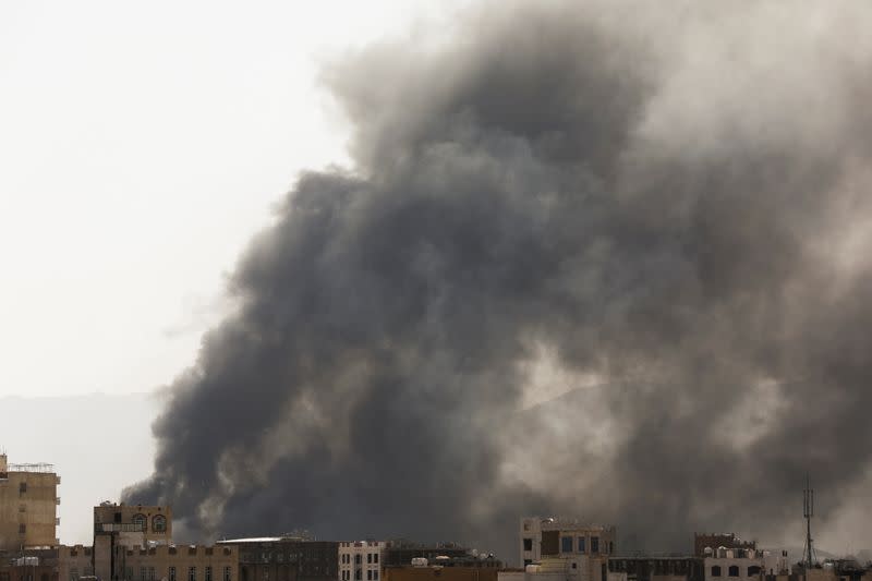 Smoke billows from the site of Saudi-led air strikes in Sanaa, Yemen