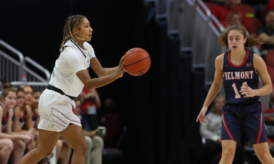 Louisville’s Ahlana Smith passes the ball away from Belmont’s Jamilyn Kinney.Dec. 5, 2021