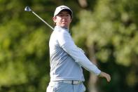 May 6, 2016; Charlotte, NC, USA; Rory McIlroy of Northern Ireland reacts to his shot to the 16th green during the second round of the 2016 Wells Fargo Championship at Quail Hollow Club. Mandatory Credit: Jim Dedmon-USA TODAY Sports